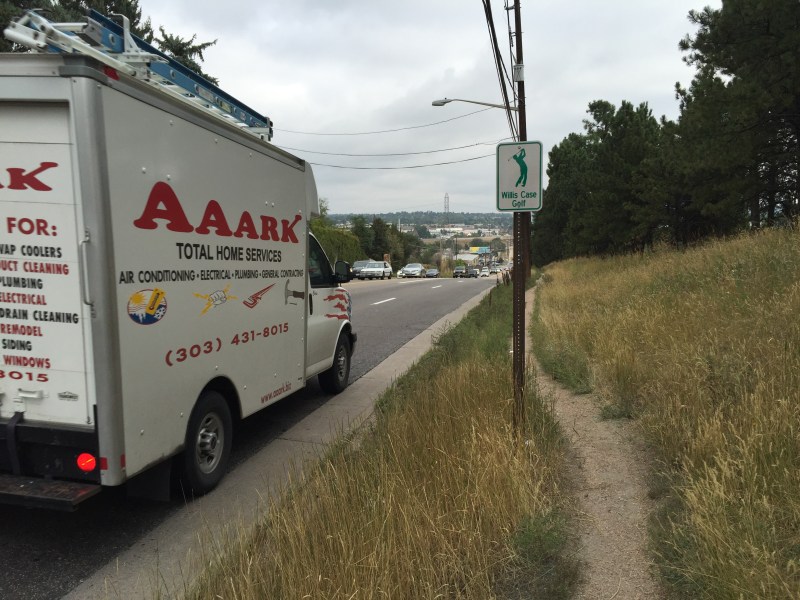 Sheridan Boulevard, where speeding trucks whisk by an overgrown dirt path instead of a sidewalk. Photo: David Sachs