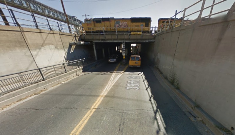 People biking and walking the 38th Street underpass near a light rail station need a safer design, but it may come with more car lanes. Image: Google Maps