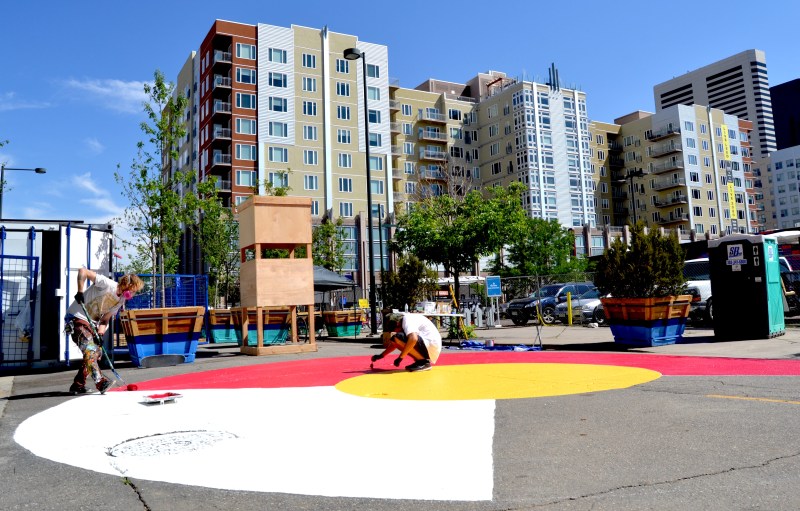 Artist Pat Milbery paints a 40-foot mural on 21st Street between Larimer and Lawrence streets. Photo: David Sachs