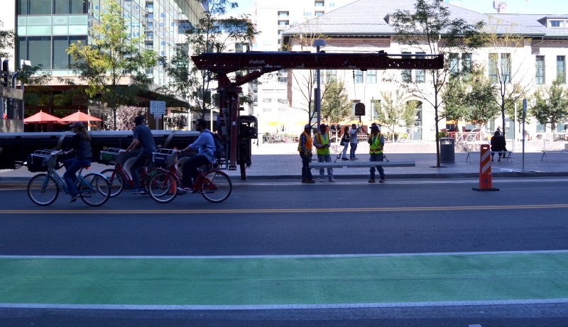 Denver Public Works workers install curbs on Wynkoop Street. Photo: David Sachs