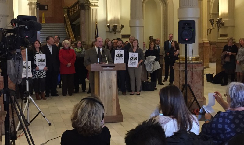 Joe Lamers, who is blind, speaks in favor of the Colorado legislature restoring funding Monday morning at the Capitol. Photo: David Sachs