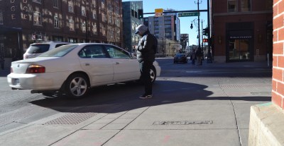 Cutting it close at one of the city's "depressed corners." Photo: David Sachs