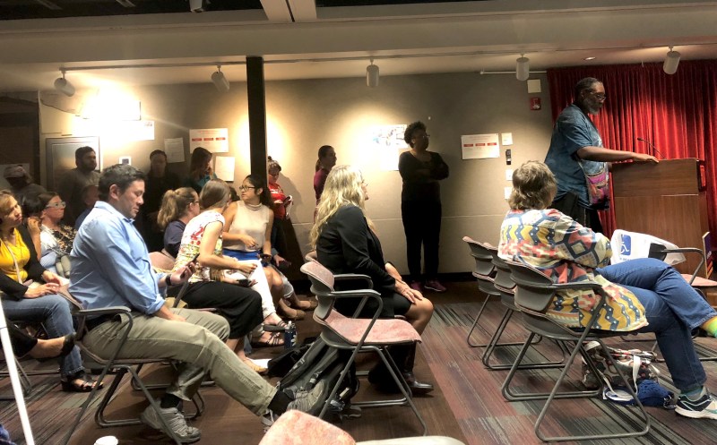Transit riders wait to speak at the podium at RTD headquarters Tuesday. Photo: David Sachs