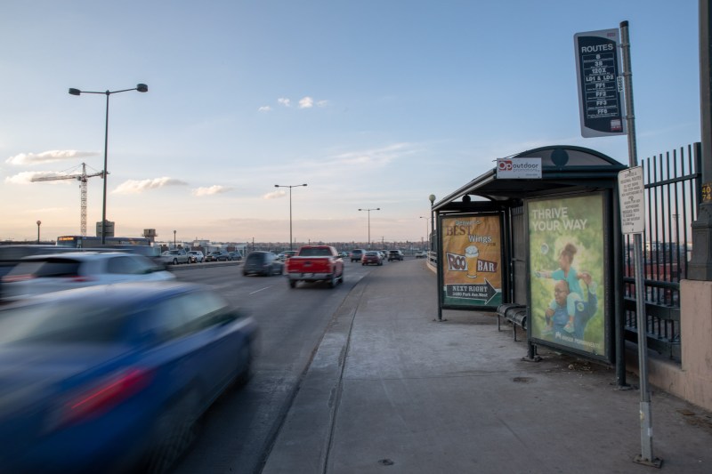 Cars zoom past one of two bus stops at Park Avenue West and Delgany, a bus stop that many people cycle to.