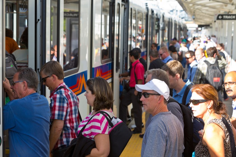 Passengers board a light rail vehicle on Sept. 17, 2014. Photo: RTD.