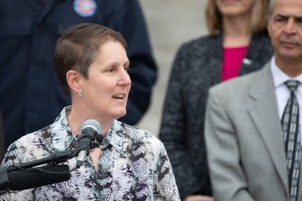 Transit advocate Piep van Heuven, chair of the Denver Streets Partnership, speaks on the steps of Denver City Hall on April 2. Photo: Andy Bosselman