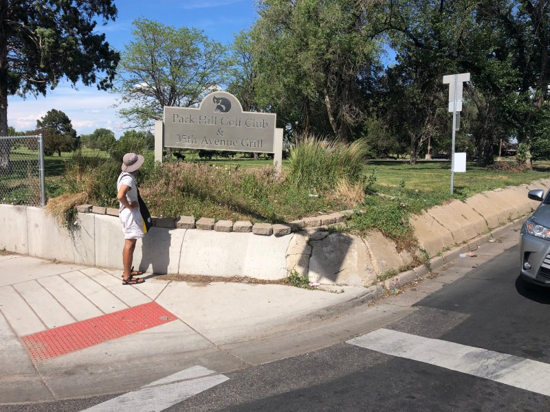 At Colorado Blvd., E. 35th Ave. has no sidewalk. A retaining wall forces pedestrians into the street. Photo: Jonathon Stalls