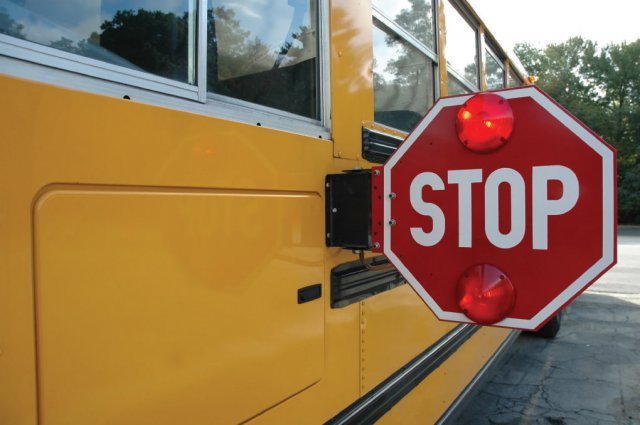 Photo school bus with stop sign