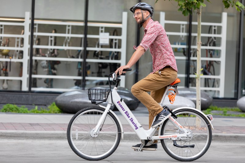 Denver B-cycle employee Greg Hoenig shows off a new electric bike. Photo: Andy Bosselman