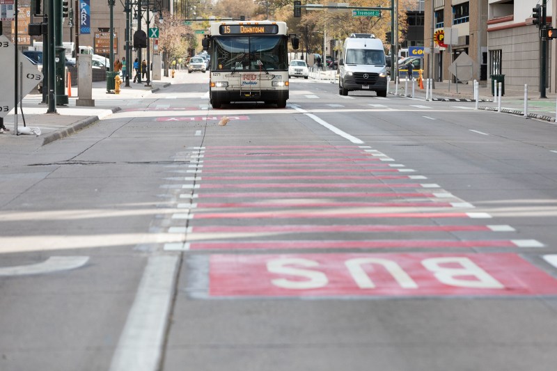 RTD 15 bus in red bus-only lane on 15th Street in Denver