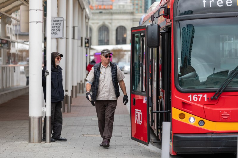 An RTD driver approaches a bus after raising the vehicle's wheelchair ramp Oct. 23 at Union Station. Photo: Andy Bosselman