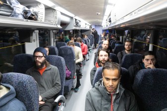 Passengers wait for the departure of the bus. CDOT said 35 people booked tickets for the first trip to Arapahoe Basin. Photo: Andy Bosselman