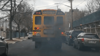 Exhaust from a school bus tail pipe on a neighborhood street