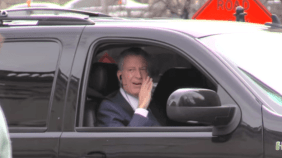 NYC Mayor Bill de Blasio in passenger seat of SUV